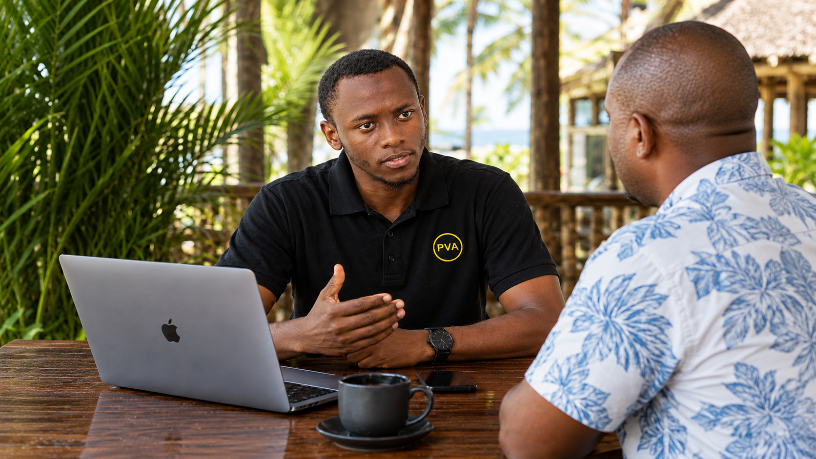 A Prolific VA team member in conversation with the owner of Modern South Hotel in Diani during one of their field days 